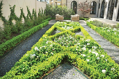 Lawns of Dallas extended the classical feel from the inside to the exterior of this home.