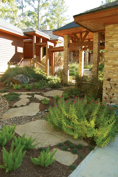 Nestled in the woods, this rustic project includes a stream, colorful foliage and a back porch that over looks the river.