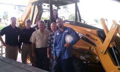 Case Community Challenge grand prize winner, Hubbard Construction received one year’s free use of a Case 580N loader/backhoe. Pictured from left to right are Jim Bansen, Case territory sales manager; David Moore and Bob Ramos, Trekker Tractor; James Ankrum Jr. Freddy Cruz and Gregoria Estrella (seated on the loader/backhoe), Hubbard Construction Company.