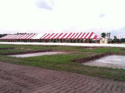 Hubbard excavated 28 “mud volleyball” courts and used the excavated material to build a berm on which the company erected a 260-foot-long tent that served as hospitality headquarters for teams contributing at least $1,500 to the March of Dimes event.