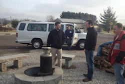 Brad Renner, general manager of Semco Outdoor enjoys lunch with CENTS show patrons at the Semco Outdoor yard, while the Semco shuttle makes a drop-off.