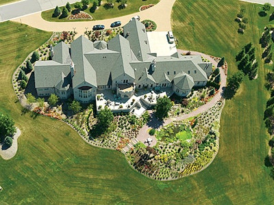 Winning the 2008 Indiana Nursery Landscape Association (INLA) Residential Landscape Maintenance Award of Excellence, this project includes thousands of perennials,a koi pond, flowering trees and shrubs for a “golf-course appeal.”