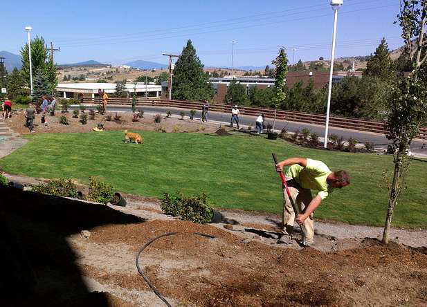 Timberline Landscape and Maintenance installed a staging area, water feature, terracing for plantings and a large sod area for a small park at the Sky Lakes Medical Center in Klamath Falls, Oregon. They used a lot of volunteer labor for all of the planting for the trees and shrubs, as well as the sod installation.