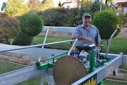 Armidale’s John Archer alongside his stone-cutting invention. Photo Credit: www.armidaleexpress.com.au/