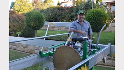 Armidale’s John Archer alongside his stone-cutting invention. Photo Credit: www.armidaleexpress.com.au/