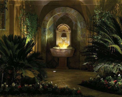 Winning the 2011 Association of Outdoor Lighting Professionals (AOLP) annual outdoor lighting design competition, this project blends architectural and landscape lighting with this water feature. Photo: Starshine of Texas