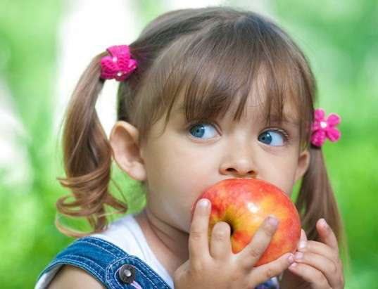 Child eating apple