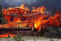 Fire consumed a home in Estes Park, Colorado, on June 23, 2012. This fire claimed as many as 21 structures. Photo: Darrell Spangler/AP