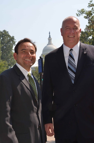 Abe Hughes (left), Vice President of New Holland North America stands with David Coker, president of the Fisher House Foundation.