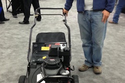 Jeff Rausch, owner of Daybreaker Lawn Care & Snow Removal, stands with the Exmark Commercial 30 mower at GIE+EXPO.