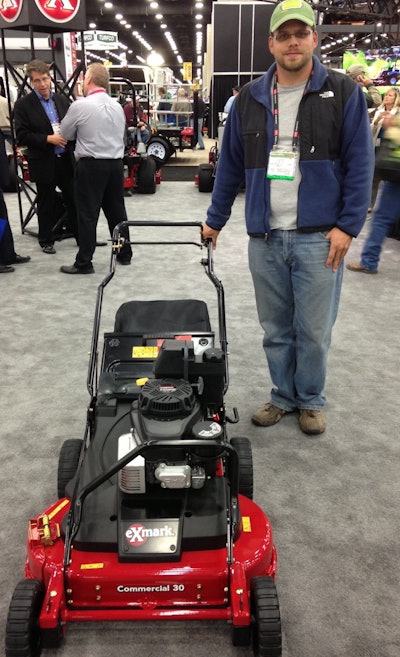 Jeff Rausch, owner of Daybreaker Lawn Care & Snow Removal, stands with the Exmark Commercial 30 mower at GIE+EXPO.