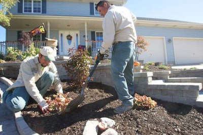 Dean’s Landscaping and Garden Center workers do some fall landscaping for clients. Photo Credit: Tony V. Martin