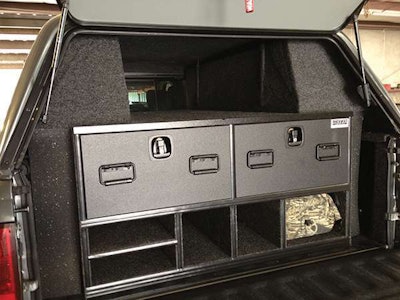 The bed cap is customized with carpet material from A.R.E. to cover the exposed white metal of the cabinet walls and interior sides/bottoms.