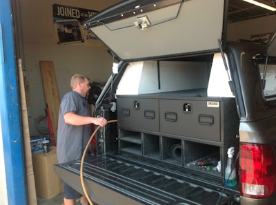 Weldon Banks, the manager of Topper World in Gulfport, Mississippi, handled the installation of cap and cargo storage insert.