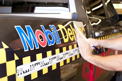 One-of-a-kind Mobil Delvac body graphics by Camoclad set the tone for the truck being one rigged for surveyors.