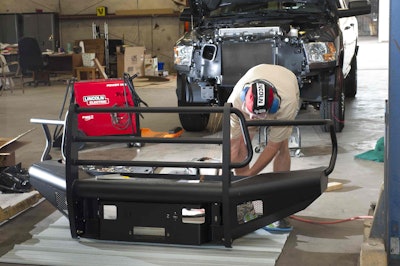 The Ram 2500’s OE bumpers were replaced with heavy-duty units from Fab Fours. The front bumper has a 12,000-pound capacity, Warn winch mounted behind its thick steel faceplate.