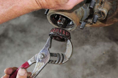 Remove the outer hub bearing.