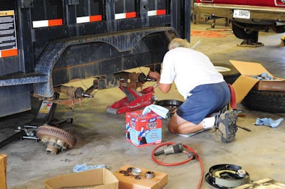 After the brake assemblies have been removed, clean and inspect axle spindles for any signs of damage or wear.