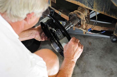 Husky brake kit slides over the axle and bolts right up to the stock flange.