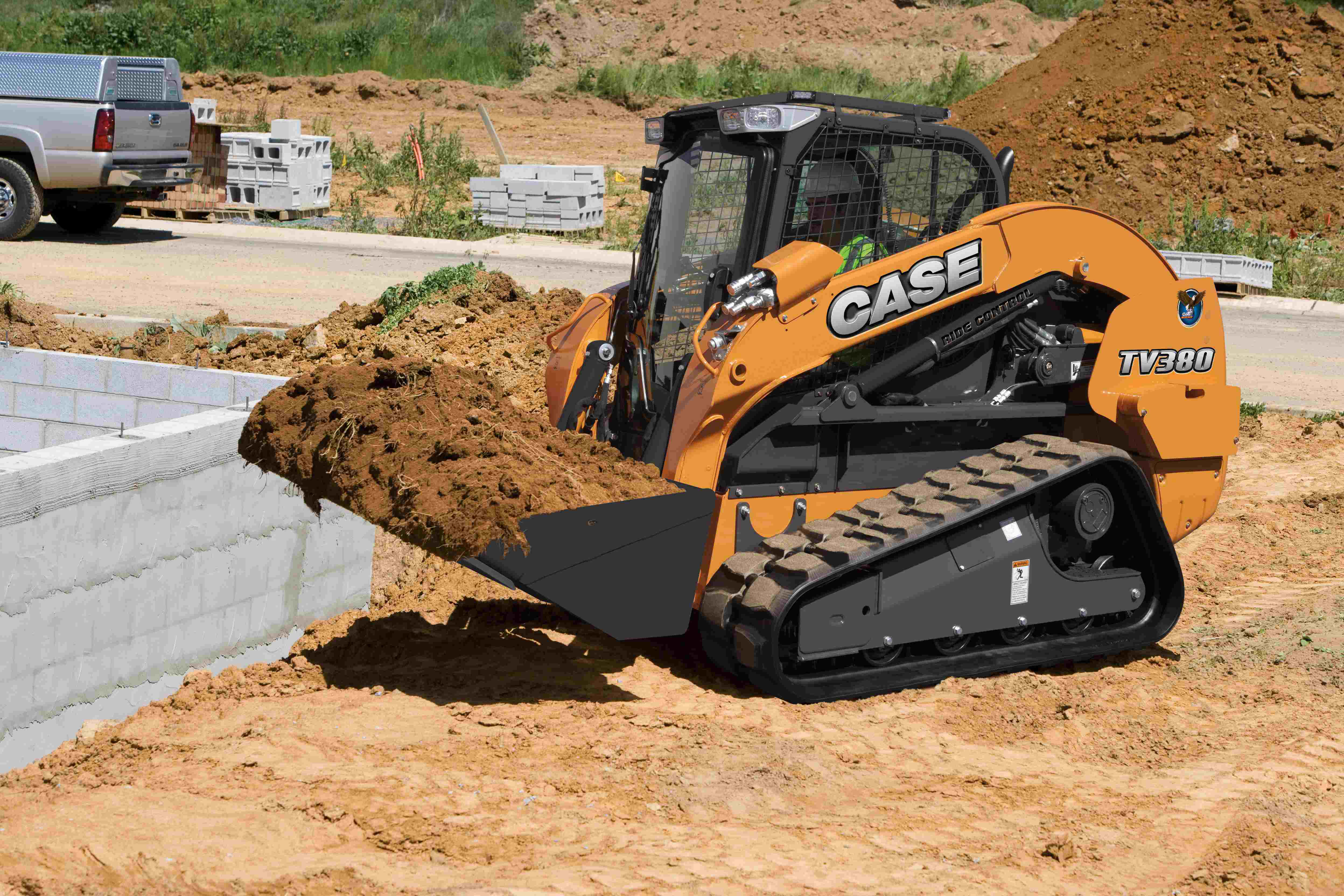Case TV380 with full bucket
