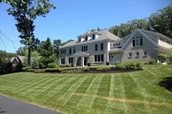 Adams Landscapes pruned, mulched and mowed this client’s yard. It’s just one of their properties they can use their new spreader on.