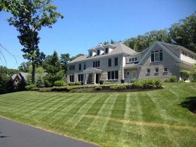 Adams Landscapes pruned, mulched and mowed this client’s yard. It’s just one of their properties they can use their new spreader on.