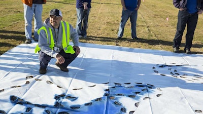 Coach George West Of St Philip The Apostle Catholic School Helps Ewing Employees And Partners Paint The School Mascot On The Field