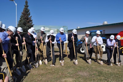 Abe Hughes and Mark Hooper from New Holland Agriculture participate in groundbreaking ceremonies for the New Holland Pavilions in Madison, Wisconsin.
