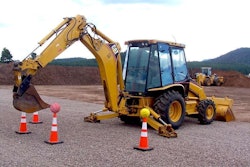 A patron at Big Toy Playground attempts to use a backhoe bucket to remove a basketball from a cone. Credit: Big Toy Playground