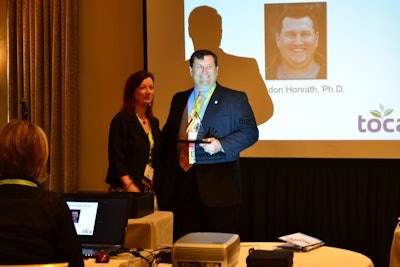 Project EverGreen Executive Director Cindy Code presents Brandon Horvath, assistant professor in the Department of Plant Sciences at the University of Tennessee, with the TOCA Environmental Communicator of the Year award. Photo: Project EverGreen