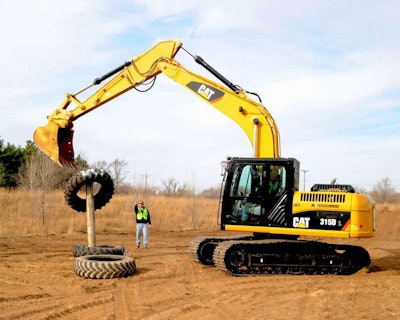 A patron operator at Extreme Sandbox plays ring toss with tires. Credit: Extreme Sandbox
