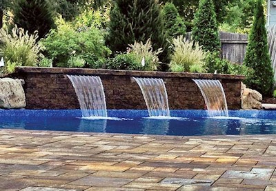 Located in Commack, New York, these sheer-descent waterfalls by Cedar Rdige Landscapes are 2 feet long and installed into a Cambridge MaytRx 3-foot wall stone.