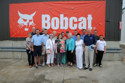 Pictured are descendants of the Melroe and Dahl families. The Melroe and Dahl families helped the original Melroe Manufacturing Company produce, market and brand the original Bobcat loader. Sylvan Melroe (pictured in the blue shirt, far right, first row)