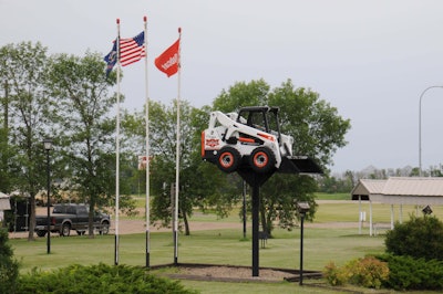 A Bobcat Special Edition One Millionth Loader Sits Atop A Pole At The Entrance To Gwinner, North Dakota, Home To Bobcat Company’s Primary Production Facility