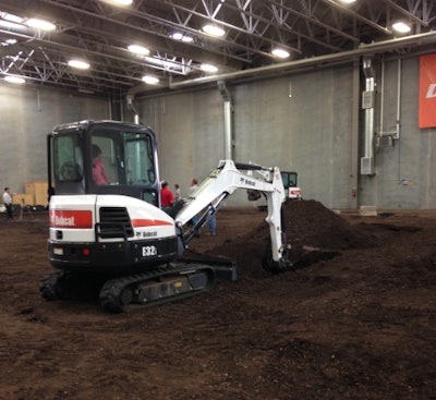 Bobcat excavator digs at Acceleration Center