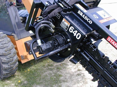 Power is supplied to the Bradco 640 Trencher by this skid steer’s auxiliary hydraulic system.