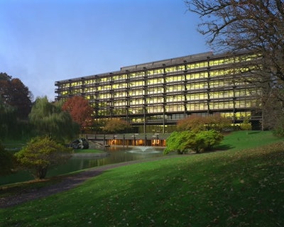 Cor-Ten steel beams are used as a structural exoskeleton. The unfinished steel weathers naturally to a muted, reddish brown color. The lattice like steel exoskeleton shields the interior from direct sunlight without obscuring the views or shutting out nat