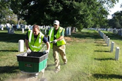 Tom Warfel (left) helps a fellow volunteer at Renewal and Remembrance.