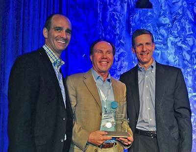 RISE (Responsible Industry for a Sound Environment) President Aaron Hobbs (left) and RISE Chairman Steve Gullickson (right) present the 2014 Grassroots Excellence Award to Mark Schlossberg (middle), president of Pro-Lawn-Plus.