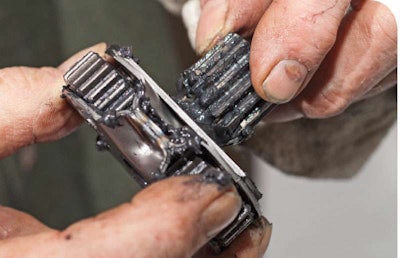 This Sun Gear Engages The Carrier On One End And A Set Of Planetary Gears On The Other End