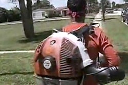 Carlos Repicio blows grass from the sidewalk, like he did the morning of the attack.