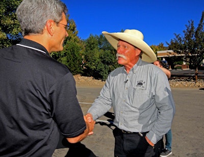 Gary Hornbacher, Vice President Of Sales And Marketing, Letting Steve Klumker Know He Is The Winner Of The Million Loaders Celebration Contest