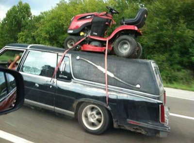 Mower on top of car