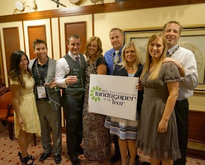 Rudy Larsen, third from the left, and his team celebrated winning the Landscaper of the Year.