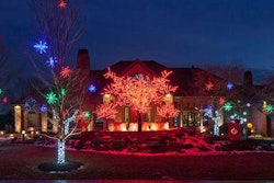 McKay Landscape Lighting installed three LED cherry blossom trees and one 16-foot and two 8-foot trees that rotate through the RGB color wheel. They also added 24-inch LED red, green and blue starbursts hanging in the crabapple trees with LED white minis wrapped around the trunk. On the house, they hung a 5-foot LED multi-color wreath.