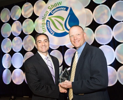 Michael Dukes, PhD, (right) accepts the 2015 Excellence in Education Award from Foundation Chair J. Louis “JR” Bergantino.