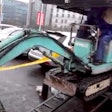 Guy-loads-excavator-into-minivan