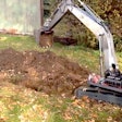 Kid-with-RC-excavator-digging-trench