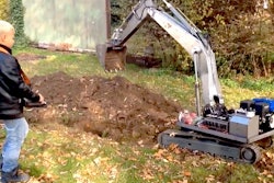 Kid-with-RC-excavator-digging-trench