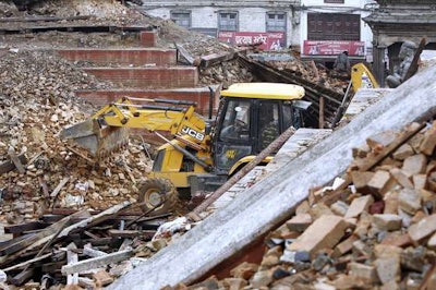 A JCB backhoe at work on April 28 in the earthquake disaster area in Kathmandu, Nepal.
